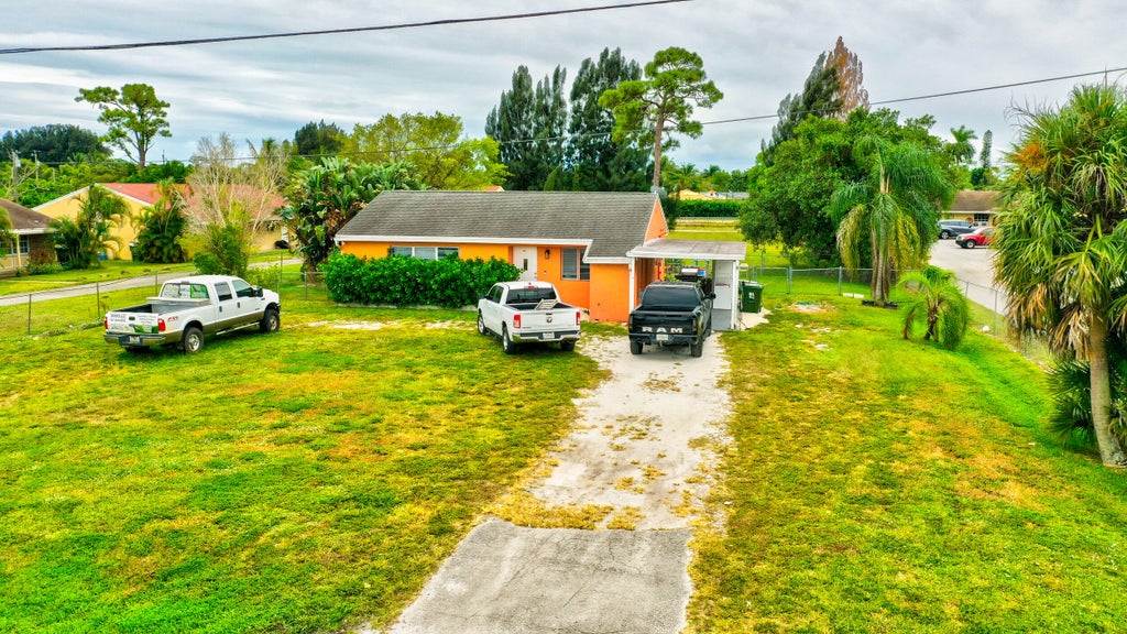 Photo of 3856 7th Avenue N, Palm Springs, FL 33461 (MLS # R10982789)