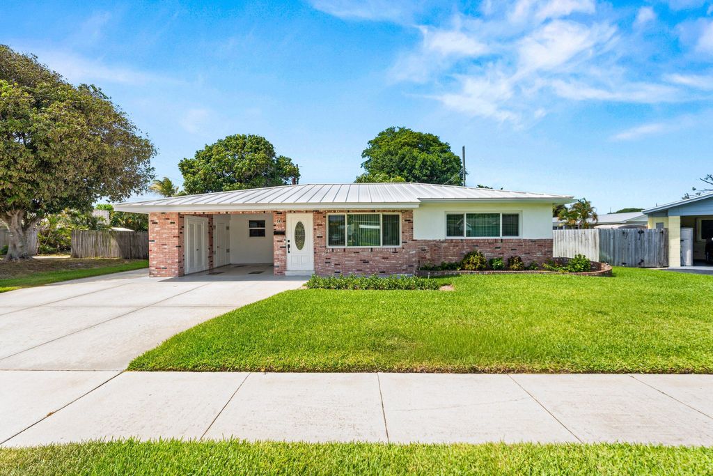 Photo of 245 Greenbriar Drive, Lake Park, FL 33403 (MLS # B26033993)