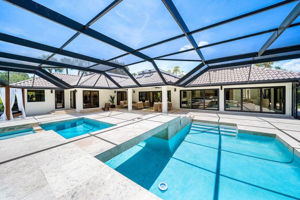 Photo of 1648 Breakers West Boulevard, West Palm Beach, FL 33411 (MLS # B26025988)