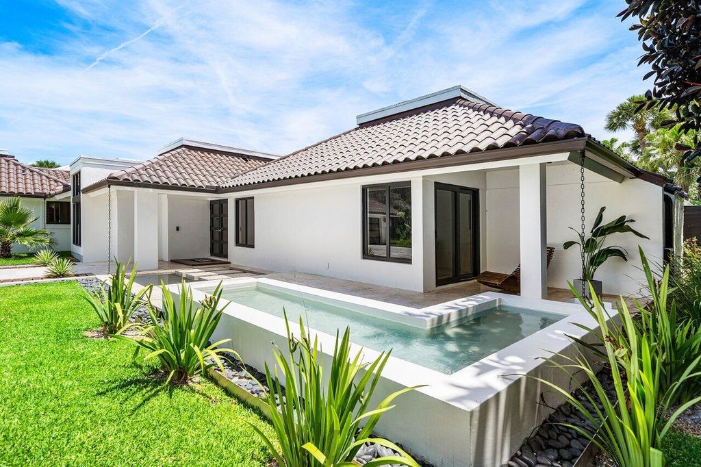 Photo of 1648 Breakers West Boulevard, West Palm Beach, FL 33411 (MLS # B26025988)