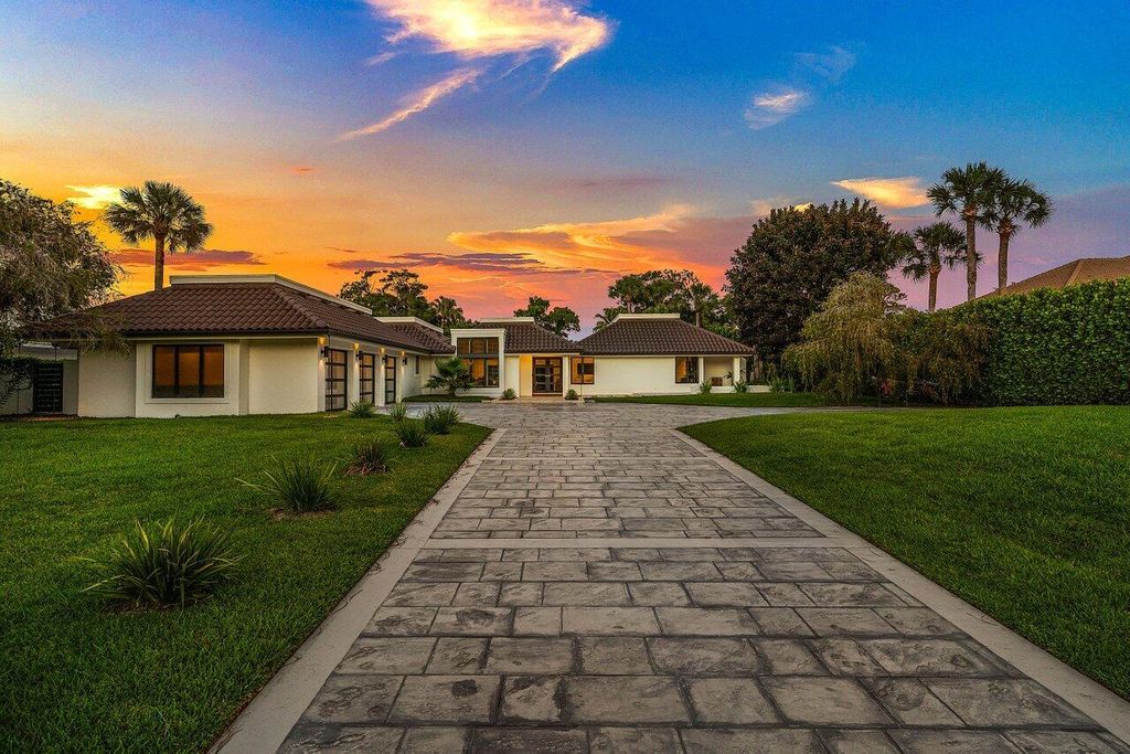 Photo of 1648 Breakers West Boulevard, West Palm Beach, FL 33411 (MLS # B26025988)