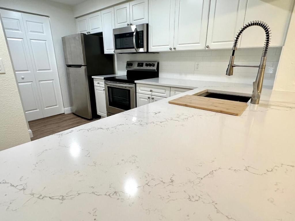 Photo of 3018 Alcazar Place #106, Palm Beach Gardens, FL 33410 (MLS # R10973822)