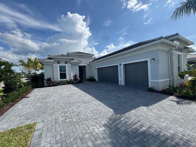 Gorgeous Salerno Contemporary on Prime Corner Homesite. This beautifully designed Salerno Contemporary features a spacious three-car garage. A double-door entry with glass panels welcomes you into a bright, open layout enhanced by porcelain wood-look tile throughout. The chef's kitchen impresses with a two-toned design, upgraded KitchenAid appliances with double oven, and an oversized island with quartz waterfall countertop--perfect for entertaining. The luxurious primary suite offers double walk-in closets and a spa-inspired bath complete with walk-in shower and a separate drop-in soaking tub. Step outside to your private oasis, complete with a sparkling pool, and enjoy the serenity of the outdoors with pre-plumbed stub outs for a future outdoor kitchen.