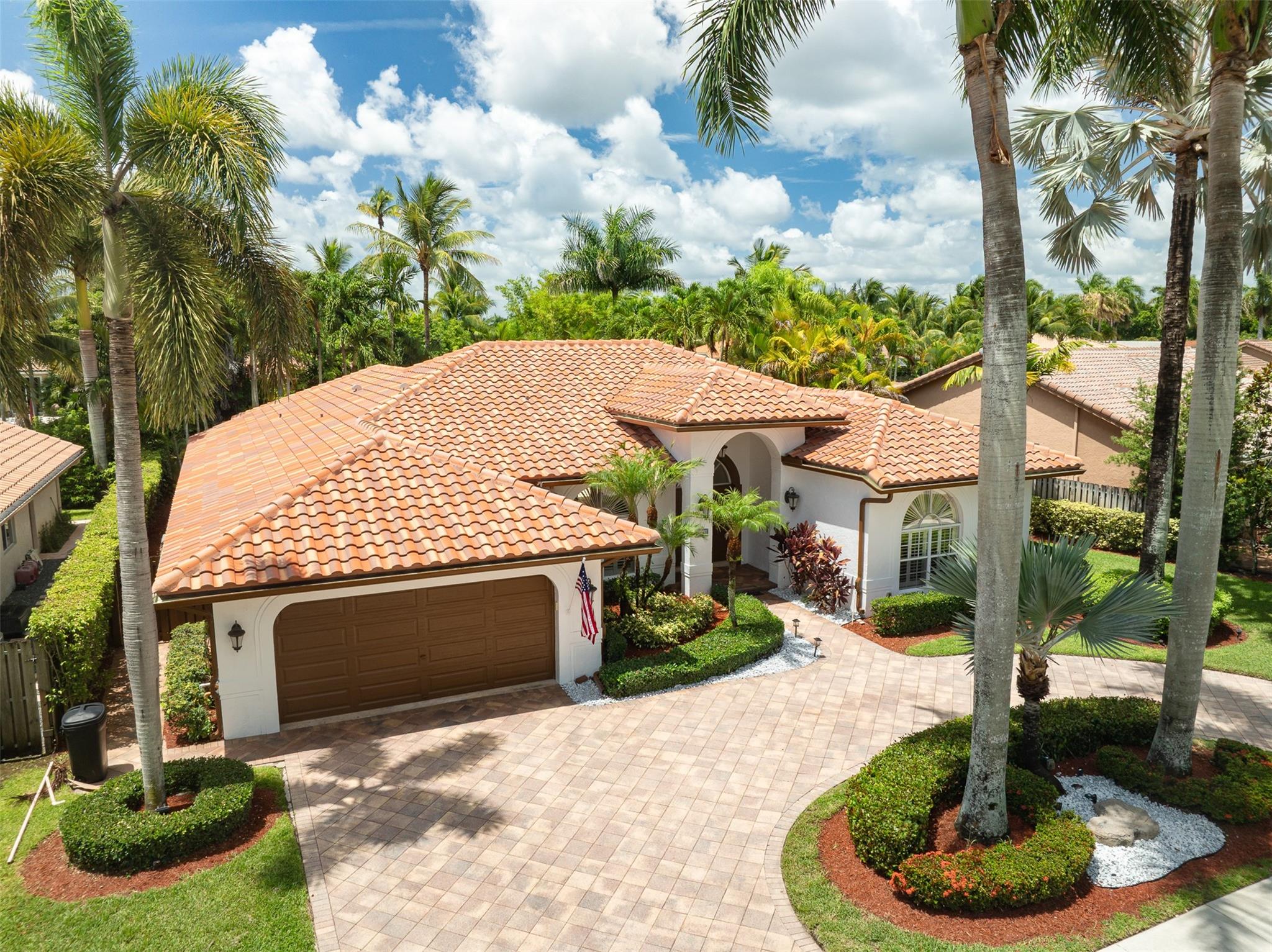 Impeccable gem in the Westport community! This stunning 5-bed, 3.5-bath waterfront pool home on a quiet cul-de-sac exudes elegance and comfort. Recently painted inside and out. New roof in 2021, dual zone A/C units new in 2023 and a water heater in 2024. Lovely volume ceilings with crown molding. Includes thoughtfully designed built-in closets providing ample storage. The open-concept kitchen seamlessly connects to the family and breakfast areas, offering views of the pool and tranquil lake. From the pool you are steps away from a desirable cabana bathroom and outside shower. A circular driveway leads to a 2-car garage with custom built-in shelving. The sprinkler system draws water from the lake, ensuring lush landscaping that enhances the home’s beauty. This home is truly pristine!