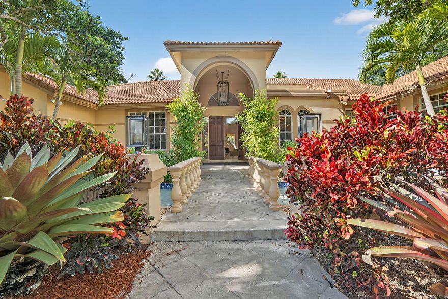 A rare South Florida treasure. This stunning one-story, 6 bedroom, 5.5 bathroom custom estate offers over 5,200 sq ft of living space and sits on just over 1 acre of pristine land with breathtaking lake views, located inside one of Coral Springs' most exclusive gated communities. Properties like this simply do not come to market often--this is a true needle in a haystack.Originally renovated in 2016 with high-end finishes throughout, this home combines architectural character with modern luxury. The entrance is one of the most unique features of the property: a front moat-style fountain and water feature with a beautiful bridge walkway leading to the main double-door entry. It creates an elegant and memorable first impression unlike anything found in today's cookie-cutter communities