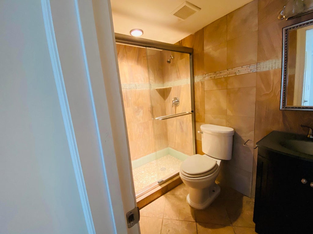 Photo of 11 GOLFS EDGE A, West Palm Beach, FL 33417 (MLS # B26086900)