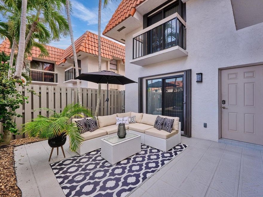 Experience upscale living in this modern East Boca townhouse featuring two spacious master ensuite bedrooms and 2.5 baths. The open-concept design showcases a gourmet kitchen with Miele stainless steel appliances, Colette cabinetry, and granite countertops. Porcelain tile floors on the first level and rich engineered hardwood upstairs add elegance throughout. Enjoy a private laundry room with full-size washer and dryer, a tranquil courtyard perfect for entertaining, and convenient parking. Ideally located near Mizner Park, Palmetto Park shops, and less than a mile from the beach--this home perfectly blends luxury and location!