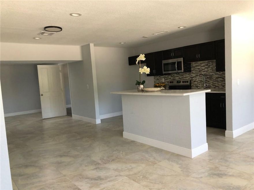 BEAUTIFUL FULLY RENOVATED 4 BEDROOMS, 3 Full BATHROOMS SINGLE FAMILY HOME. MOVE IN READY. HAS STAINLESS STEEL APPLIANCES. HOUSE IS FRESHLY PAINTED.  UPGRADED AND UPDATED WITH IMPACT WINDOWS.  STAINLESS STEEL REFRIGERATOR WILL BE INSTALLED PRIOR TO CLOSING.  NO DISH WASHER IN HOUSE.  PLENTY PARKING SPACE. AND NO HOA