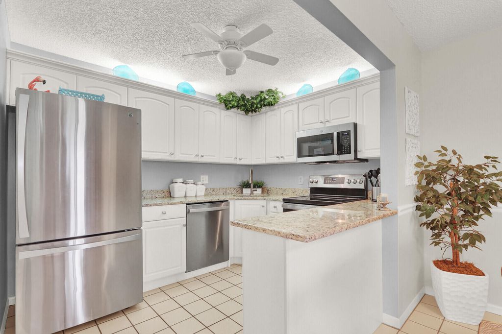 Photo of 323 Knotty Pine Circle #A2, Greenacres, FL 33463 (MLS # B26005428)