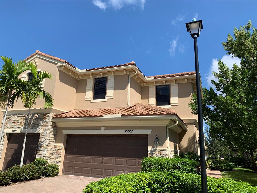 Luxury Lakefront Town-home in like new condition built in 2015 and located in desirable Wellington within a great school district. This 4 bedroom, 3 full bath, 2 car garage corner Town-home has the largest floor plan per square foot in this family friendly development. The stunning paver driveway and entry leads into a spacious living area with beautiful neutral color tile throughout the first floor. The large kitchen boasts granite countertops, gorgeous wood cabinetry and stainless steel appliances. The second floor is carpet throughout with a large master suite connecting the master bath with dual sinks, a roman tub and a private shower enclosure. The private paver patio and backyard is connected to beautiful tranquil lake views. The only townhome Bld that includes Guest parking spaces.