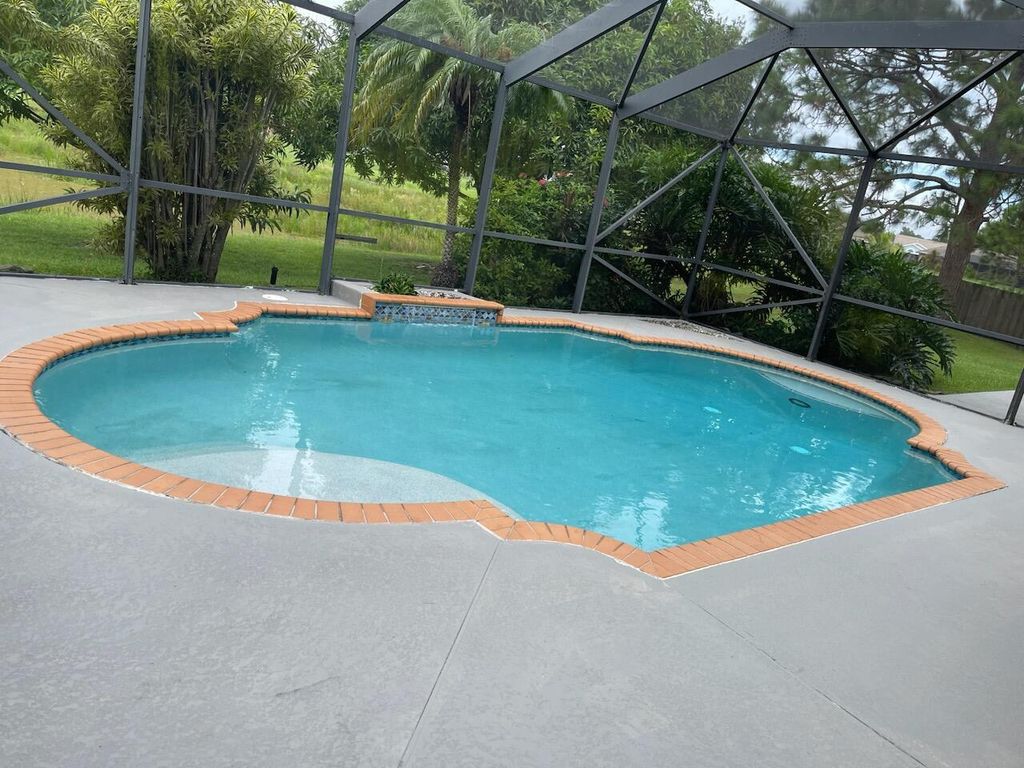 Photo of 5420 NW Emblem Street, Port Saint Lucie, FL 34983 (MLS # R11028541)