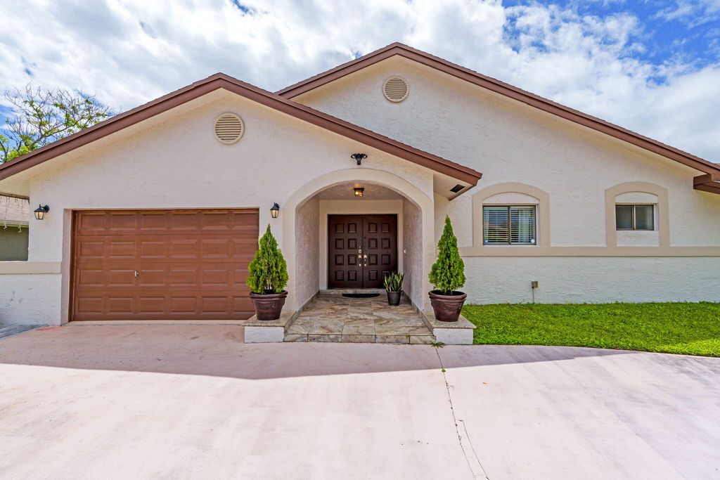 Photo of 10218 NW 71st Place, Tamarac, FL 33321 (MLS # B26013994)