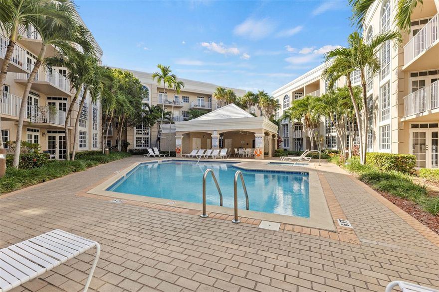 Beautifully remodeled 2BR/2BA Abbey model with a desirable split-floorplan layout, privately tucked behind the pavilion in a lush tropical courtyard just steps to the pool/hot tub. Interior features Travertine marble floors, two primary suites, updated bathrooms, and a modern kitchen with quartz countertops, stainless steel appliances, and soft-close cabinetry. Enjoy a new central A/C & hot water heater, ceiling fans throughout, walk-in closets, and French doors from both the primary bedroom and living room leading to the patio. Secure building with TV cameras, nighttime roaming security, and tele-entry system. Prime location directly across from UM & Metrorail; walk to Publix, Sunset Place, Whole Foods, LA Fitness, Madruga Bakery, yoga studios, and Boogie’s live music. No car needed!