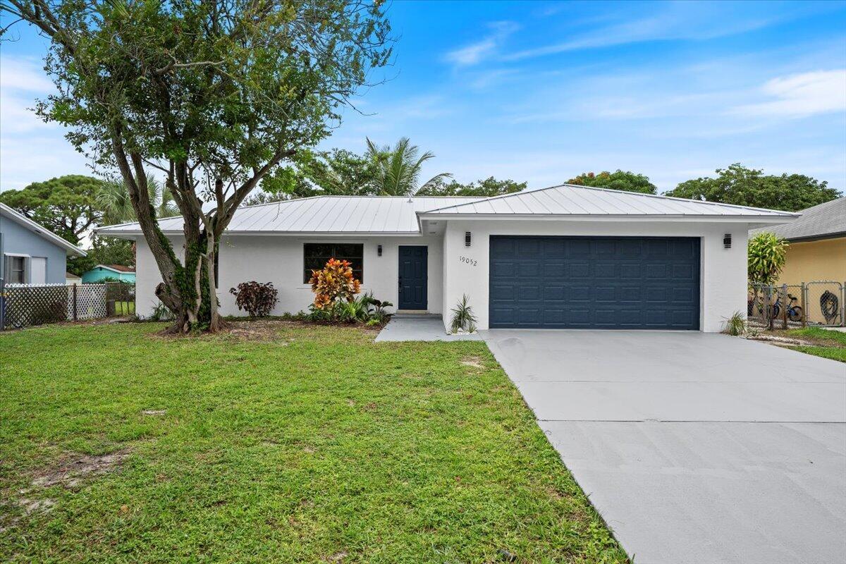Experience coastal living at its finest with this stunning, fully updated concrete block home just 2.5 miles from the beach! Featuring a brand-new 2025 standing seam metal roof and brand-new impact windows being installed this month, this home offers exceptional durability, energy efficiency, and peace of mind. Inside, you'll find gorgeous designer finishes throughout, including luxury plank wood-look flooring with a lifetime warranty, quartz countertops, stainless steel appliances, and modern light fixtures and fans.The spacious floor plan provides plenty of room to live and entertain, along with a full two-car garage and a large fenced backyard--perfect for outdoor enjoyment. With no HOA, you'll have the freedom to use your property as you wish. Enjoy lower taxes thanks to Martin