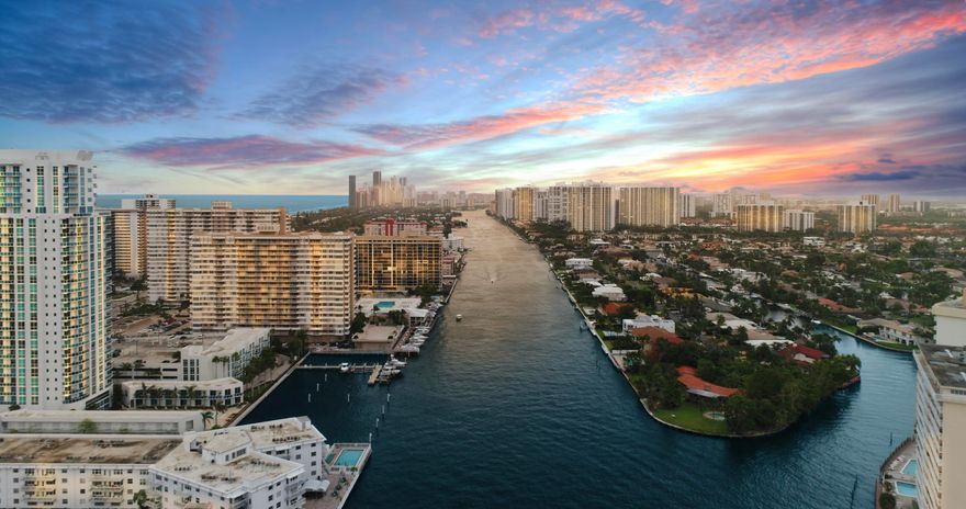 A GOLDEN opportunity! This private peninsula is graced by panoramic views of aquatic grandeur with close to an acre of land!  Move in immediately, add a personal touch with custom renovations, build a second level for more sparkling water views, or subdivide this point lot to build 2+ homes … a developer’s dream. Boaters will covet the canal’s depth of 10 ft and a massive seawall, about 558 linear ft!  This is a rarity – one of the largest deepwater properties in Broward County. With more than 230 ft of seawall on the canal side, a sizable yacht won't interfere with Intracoastal views. A Chicago brick circular driveway leads guests to a timeless 1-story estate, framed by tropical landscaping. Golden Isles affords the safety of a manned gate, no HOA, and the convenience of local amenities! Amenities include nearby playground, walking trails, basketball court, beaches, upscale shopping, fine dining, arts and entertainment, casino ... hallmarks of luxurious living in South Florida.