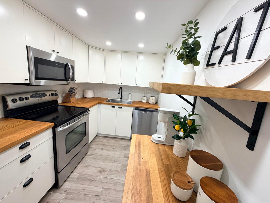 Photo of 3700 N PINE ISLAND Road #210, Sunrise, FL 33351 (MLS # B26091764)