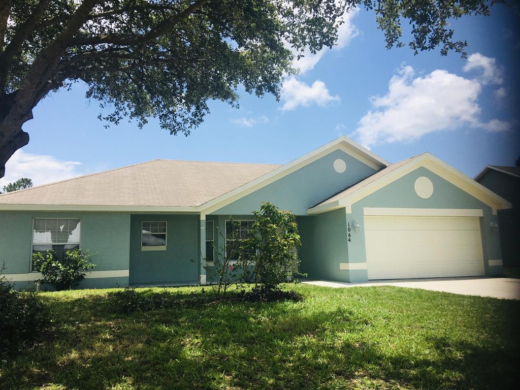 Photo of 1044 SW Ingrassina Avenue, Port Saint Lucie, FL 34953 (MLS # R10977379)