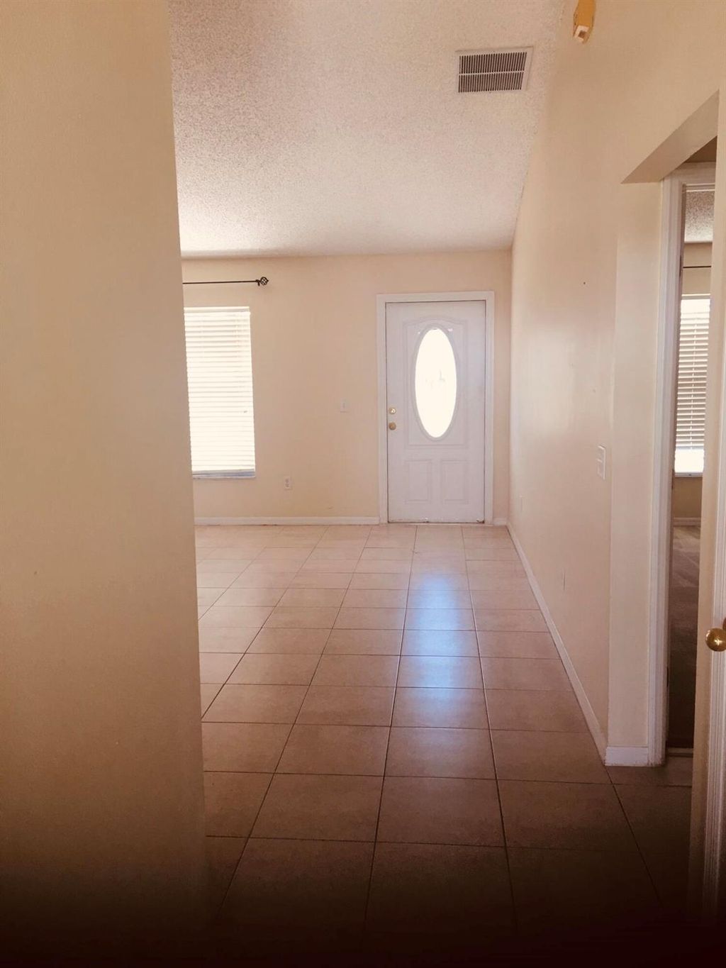 Photo of 1044 SW Ingrassina Avenue, Port Saint Lucie, FL 34953 (MLS # R10977379)