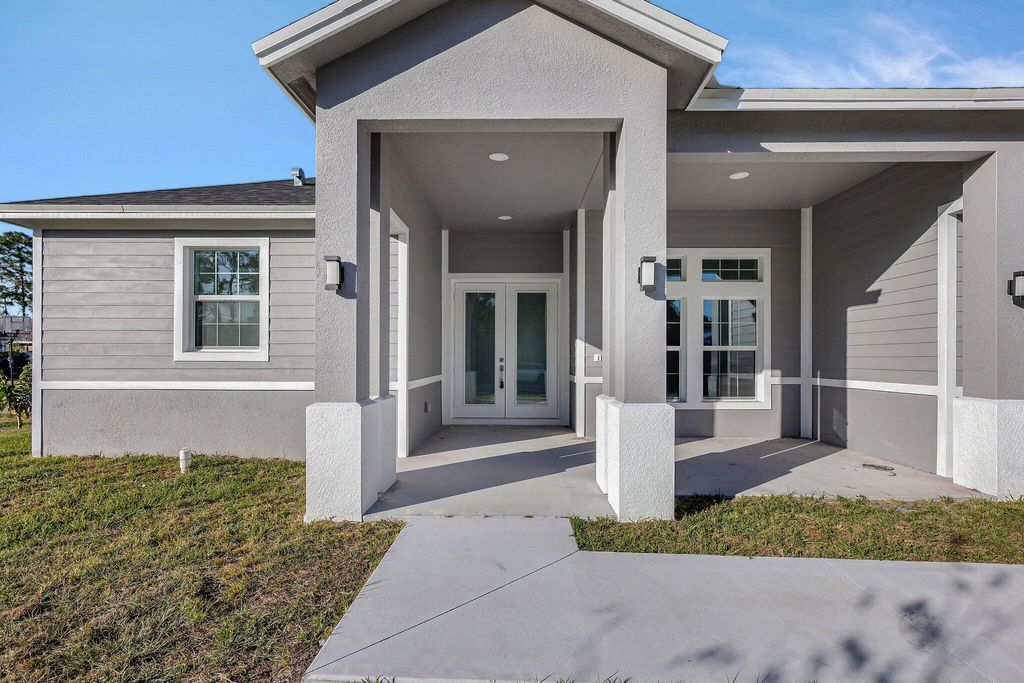 Photo of 1791 SW Effland Avenue, Port Saint Lucie, FL 34953 (MLS # R11161768)