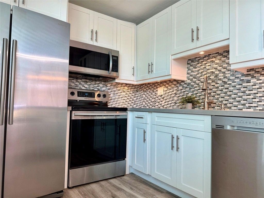 Photo of 9440 Tangerine Place #107, Davie, FL 33324 (MLS # F10497348)