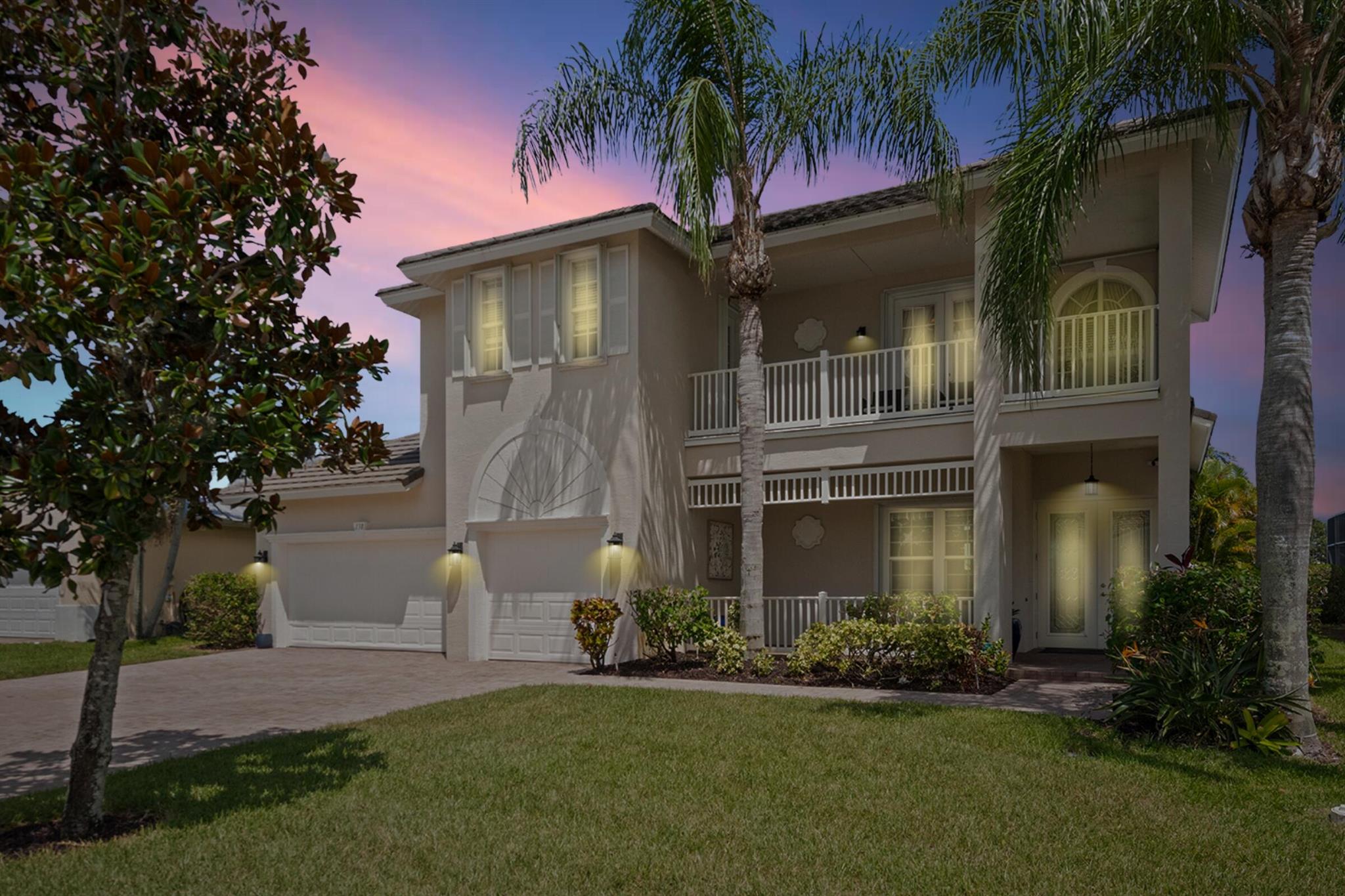 Lakefront, Renovated, and Move-In Ready in a Private Gated Community in the Heart of St. Lucie West. Welcome to this gorgeous and spacious 5-bedroom + office, 3.5-bath home with soaring ceilings, a 3-car garage, and one of the best lake views in Magnolia Lakes.Set on a premium waterfront lot, this home combines timeless design with thoughtful updates throughout. Step through the impact double doors into a bright, open layout with 20+ foot ceilings and sun-filled interiors that feel both grand and welcoming.Enjoy a remodeled kitchen and primary bathroom (2023), new luxury flooring, fresh interior paint, and full storm protection with impact windows and accordion shutters upstairs. Additional upgrades include a new HVAC, tankless water heater, private sauna, and low-maintenance