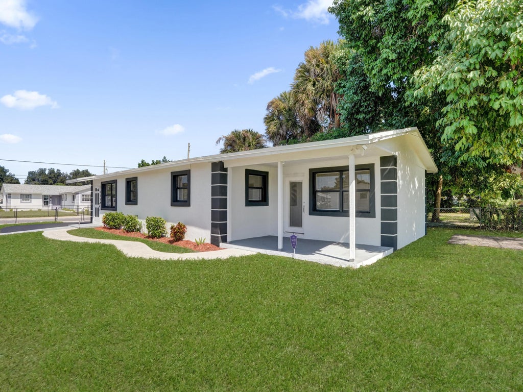 Photo of 1259 W 26th Street, West Palm Beach, FL 33404 (MLS # B26089301)