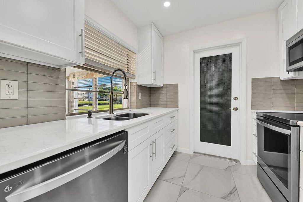 Photo of 131 NW 14th Street, Boynton Beach, FL 33426 (MLS # R11166809)