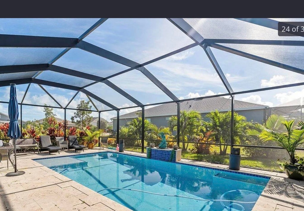 Photo of 1694 NE WHITE PINE Terrace, Ocean Breeze, FL 34957 (MLS # B26071223)