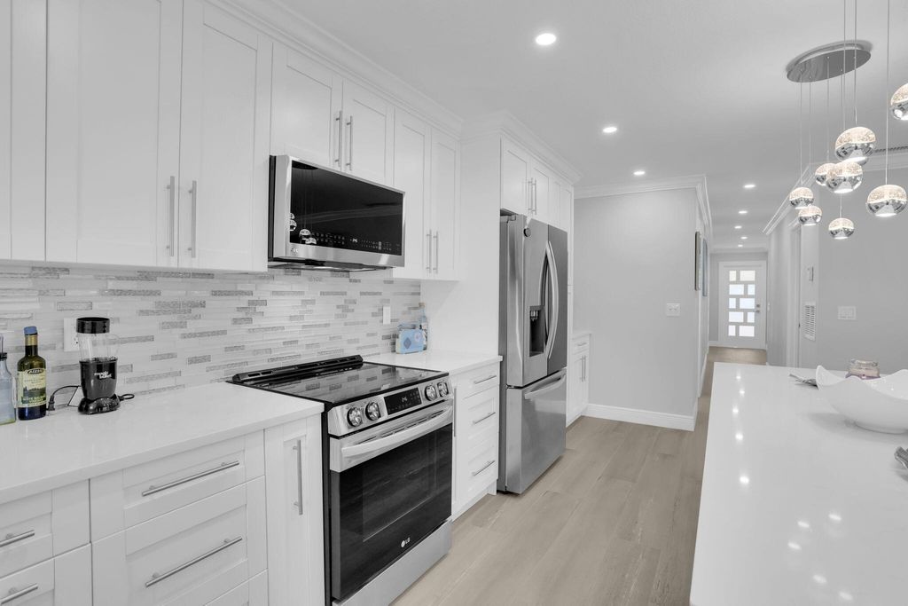 Photo of 540 High Point Dr #A, Delray Beach, FL 33445 (MLS # B26000213)