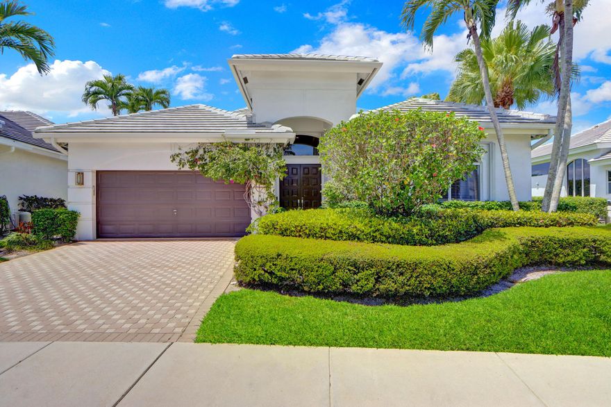 Comfort, style & unforgettable serene lake & golf course views paired with breathtaking sunsets  bursting with vibrant colors fill this beautifully renovated one-story home of 3 bedrooms, an office & 2.5 baths. Volume ceilings & sleek gray-toned wood-grain porcelain tile floors create a sophisticated flow. The open kitchen features 42" white & gray cabinetry, quartz & marble counters with a waterfall edge, tile backsplash, stainless steel appliances, and a warm wood accent wall. French doors lead to a private office; remodeled secondary bathrooms offer contemporary finishes. The spacious primary suite boasts custom-designed closets.  Relax on the patio and take in tranquil lake & golf course views. Roof 2023, A/C 2021, water heater 2017, accordion hurricane shutters for peace of mind.
