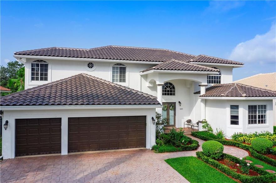 This is the home you've been waiting for! Rarely available, completely upgraded 2-story home on the 2nd hole of the Players Course at the Club at Weston Hills! This pristine 6 bed, 4.5 bath home + den addition on first floor has it ALL! Located on fully-fenced & lushly landscaped lot on quiet cul-de-sac street! Custom salt water pool w/ water feature, lg. travertine deck area, jacuzzi & summer kitchen w/ lake view, perfect for entertaining! Open kitchen w/ 9' center island, 6-burner gas stove, double oven! Master bedroom w/ private 33x14 marble balcony & newly installed spiral staircase down to pool area! New 2020 Roof! Wood floors in bedrooms! All baths remodeled! Impact glass thru/out! Crown molding! Tankless Seisco water heater! Freshly painted exterior! You must see this home!