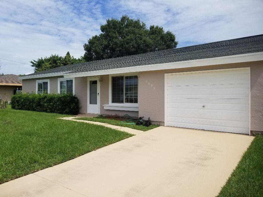 Photo of 1495 SE Grapeland Avenue, Port Saint Lucie, FL 34952 (MLS # R10733661)