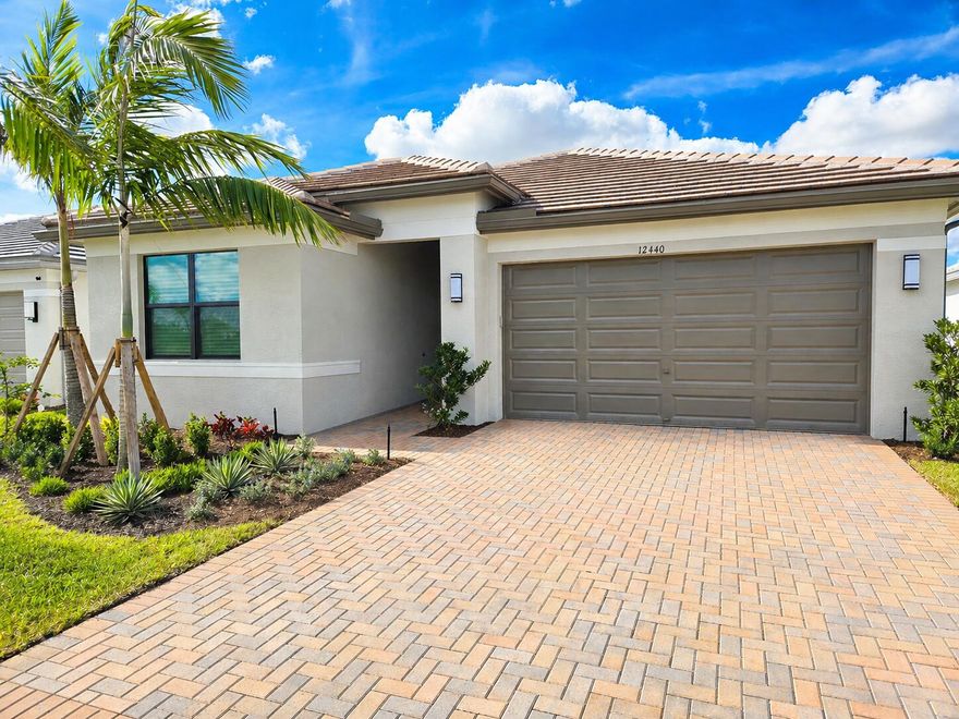 For Sale in GL Homes' highly sought after 55+ Valencia Walk at Riverland in Port Saint Lucie, FL. This very popular Sandpiper model offers 1,752 SF under air with 2 bedrooms plus a den or optional 3rd bedroom, and 2 bathrooms, perfectly designed for comfortable Florida living. The upgraded kitchen features Brazilian Black countertops, a finished refrigerator cabinet panel, a vented microwave, and a junction box ready for future pendant lighting. The spacious primary suite includes pocket doors to both closets, upgraded tile flooring in the bath, and an enhanced Moen Eva faucet. Additional highlights include tile flooring in the den, added recessed lighting, upgraded carpet padding in the bedrooms, and a laundry room with a utility sink.  The guest bath has been thoughtfully updated with an upgraded countertop, fixtures, and a glass shower door. Enjoy outdoor living on the screened lanai with extended patio pavers, a ceiling fan, and professionally designed tropical backyard landscaping that offers both beauty and privacy. Custom plantation shutters and motorized shades provide style and convenience throughout the home. Ideally located with easy access to Riverland Square, Publix, the Paseo, and the Sports & Racquet Club. Valencia Walk at Riverland offers a true resort lifestyle with a spectacular clubhouse, multiple pools, a state-of-the-art fitness center, tennis, bocce, and one of the largest private pickleball facilities in the country, featuring over 50 courts, including covered courts for year-round play. Residents enjoy a vibrant social calendar and an exceptional full-service restaurant right in the community, while the surrounding area offers an impressive array of casual and fine-dining experiences just minutes from your door. Conveniently located near Cleveland Clinic Tradition Hospital, shopping and dining in Tradition, and Clover Park for Mets spring training, this home also offers easy access to golf, entertainment, and beautiful Treasure Coast beaches, all within an approximate 30-minute drive. This is an exceptional opportunity to enjoy the best of the Riverland lifestyle in a beautifully upgraded home. Call today to schedule your private showing and experience all that Valencia Walk and Riverland have to offer.