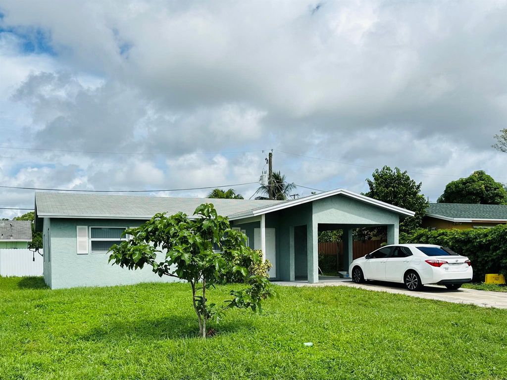 Photo of 4599 Pruden Boulevard, Lake Worth, FL 33463 (MLS # R11130961)