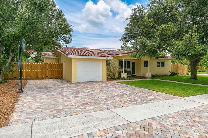 Incredibly well thought out and Completely rebuilt home.  3 stacked beds and an office. Hurricane protected with impact glass. 3 Covered porches  Freshly painted, Living area has high end Coffer ceilings. Rich Brazilian Mahogany  wood floors flow through the living areas of the home.  Massive master bedroom suite complete with large walk-in closet. Oversized paver driveway. Completely fenced corner lot boasting over 9000 sq ft. Brand new tile floors in the bedrooms Updated electric, AC, Roof,  waterheater