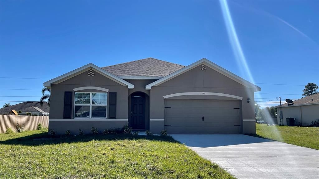 Photo of 978 SW Longfellow Road Rd, Port St Lucie, FL 34953 (MLS # R10772160)