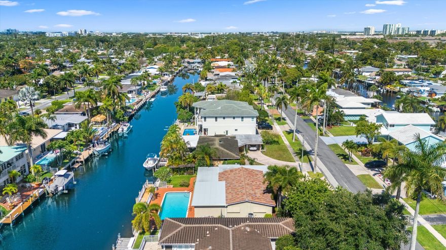 Waterfront opportunity in desirable Garden Isles! Lovingly maintained by the original family, this 3BR/2BA home features major updates: new A/C, salt water pool, pool heater, 2024 barrel tile roof, fresh exterior paint, impact windows/doors + roll-down shutters, gas water heater, seawall and dock provides peace of mind for years to come. Paved circular drive offers ample parking for entertaining. Spacious primary suite includes a flexible bonus room (office/den/gym) overlooking the pool. Kitchen and baths offer an opportunity for customization --ready for your personal touch (custom Sub-Zero fridge/freezer). Separate laundry + room behind garage door w/private entrance and a/c. No HOA. Major upgrades completed. Quiet street, strong bones and endless potential. All information must be buyer verified. Property appraiser under documents.