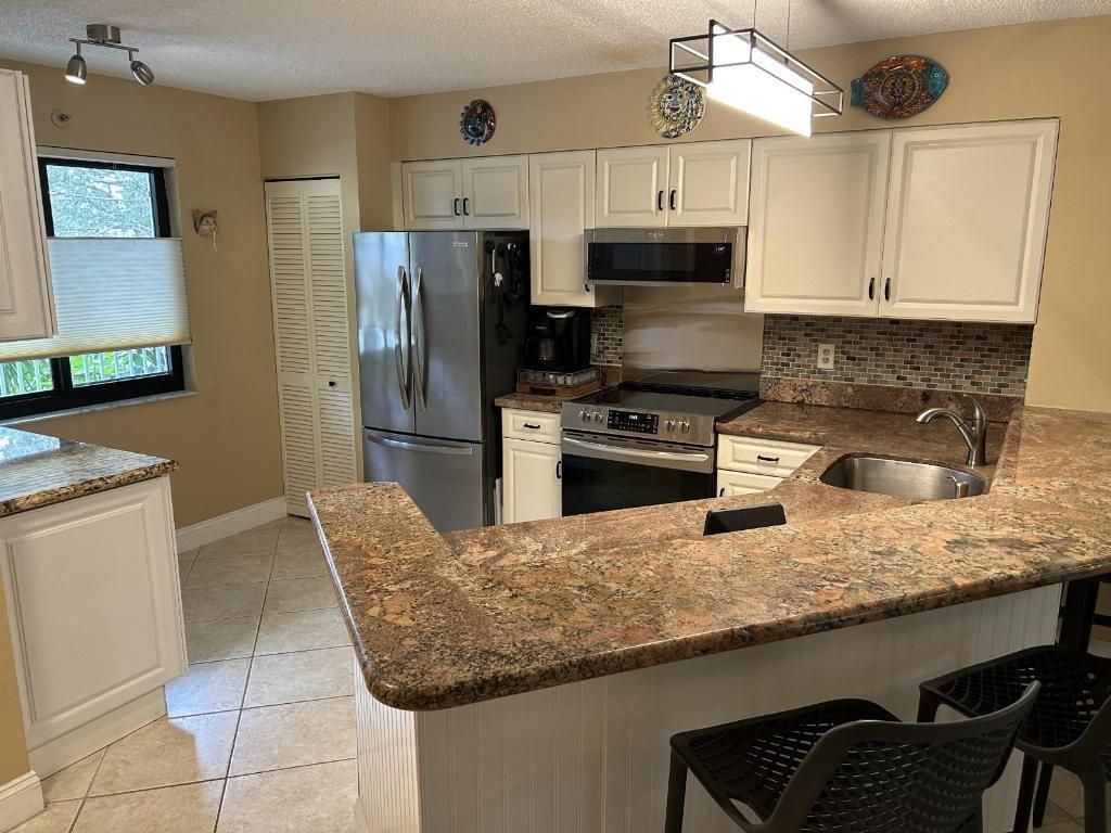 Photo of 2240 N Cypress Bend Drive #302, Pompano Beach, FL 33069 (MLS # F10412851)