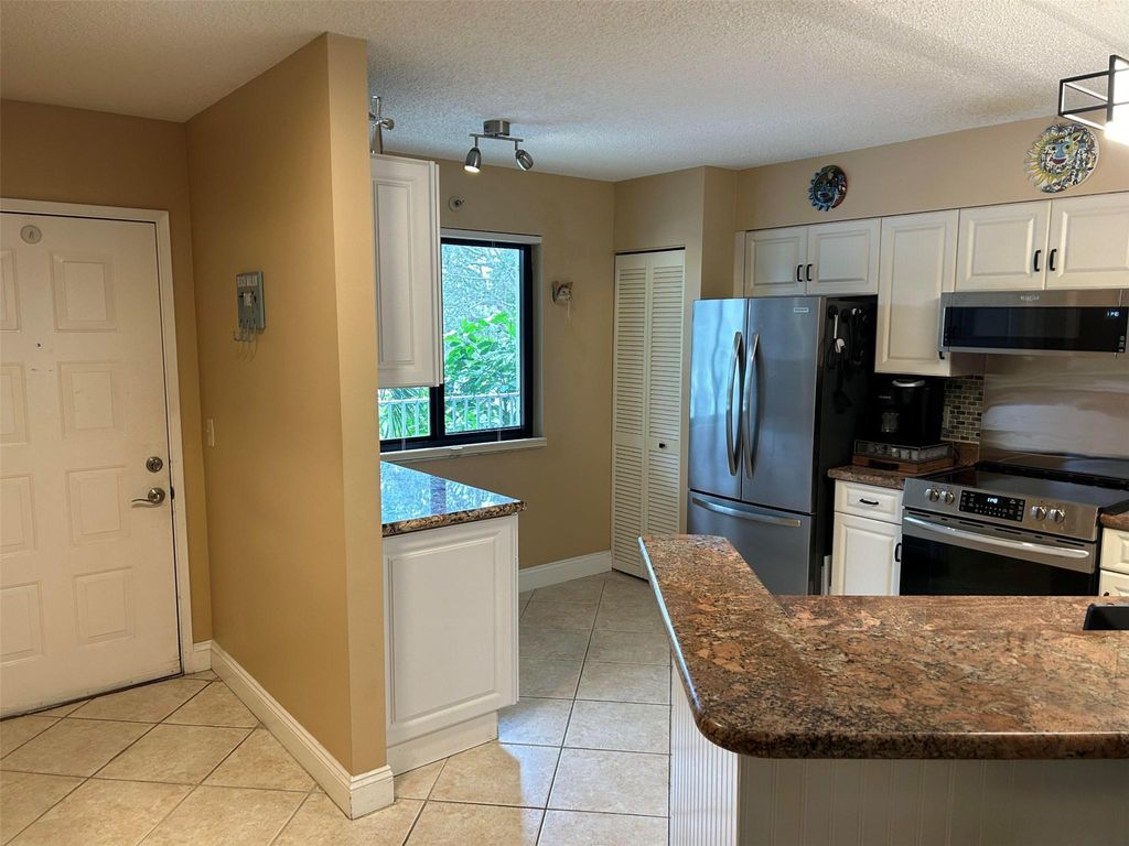 Photo of 2240 N Cypress Bend Drive #302, Pompano Beach, FL 33069 (MLS # F10412851)