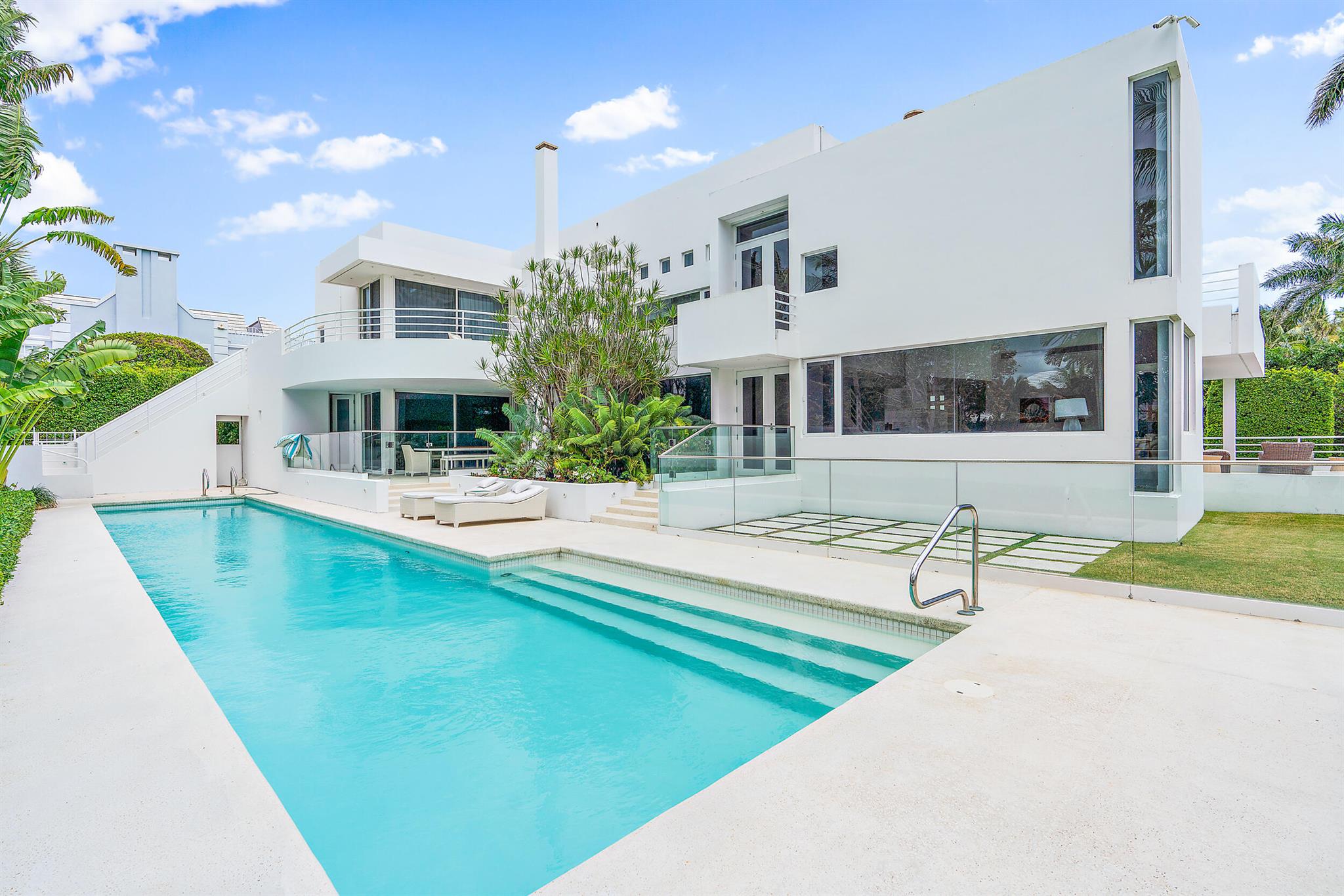 A MODERN CLASSIC - The largest home and lot currently available on the North End. A total of 7,710 s/f of space to enjoy on a large corner lot - you will have the ultimate island experience. Bespoke interiors, blue chip art & technology complete this modern estate. 5 bedrooms, 7 full baths plus formal powder room, primary suite with 2 closets and 2 baths, large kitchen, family and breakfast room, living room, dining room, an office and an additional space allow for much room for family and friends. Lots of outdoor spaces to fully enjoy the Florida lifestyle. Two houses from your private beach path and Annie's dock at the Inlet and lake trail access nearby complete this Palm Beach experience. Available immediately.