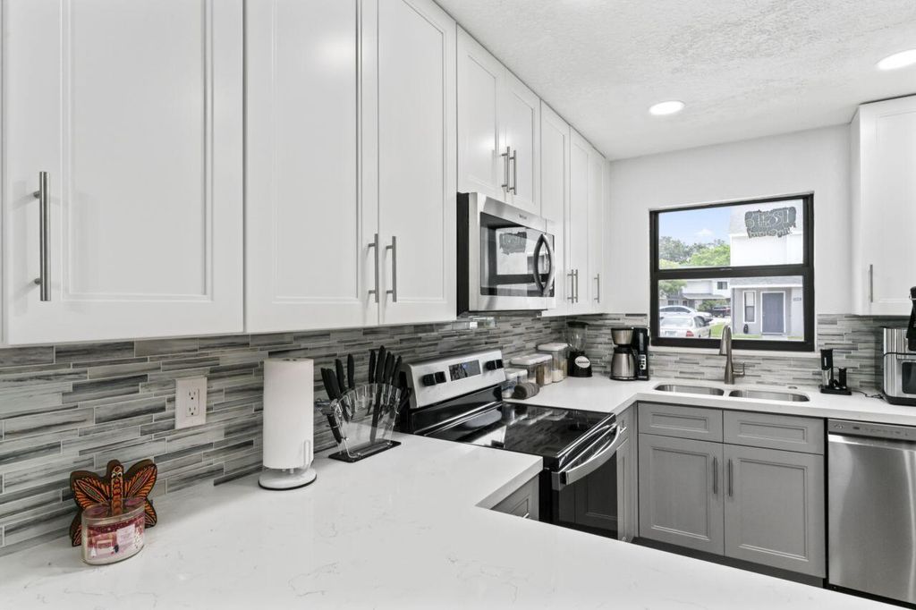 Photo of 5401 Bayside Drive, Greenacres, FL 33463 (MLS # R10993691)