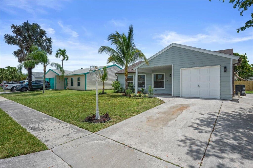 Photo of 5082 Dalewood Lane, Lake Worth, FL 33467 (MLS # B26040436)