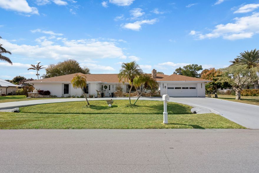 Welcome to this spacious 3-bedroom, 2-bath home in the desirable Sandpiper Bay area of Port St. Lucie, perfectly situated on beautiful Calvin Street. One of the larger homes in the community, this property offers room to spread out both inside and out with no HOA and plenty of space for all your toys. A brand-new 2025 roof provides peace of mind, while the oversized 2-car garage and large backyard add everyday functionality and outdoor potential. Inside, the home features a generous and flexible floor plan, including a large bonus room currently used as an office that could easily serve as a 4th bedroom, media room, or mother-in-law suite. The expansive Florida room spans the full width of the home, creating an incredible bonus living space perfect for entertaining, relaxing, or hosting gatherings. The kitchen is equipped with new appliances, and the home also includes accordion shutters for added storm protection. A cozy wood-burning fireplace adds charm and character, creating a warm and inviting focal point. Connected to city water and sewer, this well-located home combines size, flexibility, and major updates in one of Port St. Lucie's most established neighborhoods. Come see all the space and possibilities this Sandpiper Bay gem has to offer!