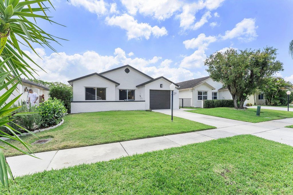 Photo of 9155 Pine Springs Drive, Boca Raton, FL 33428 (MLS # R11082342)