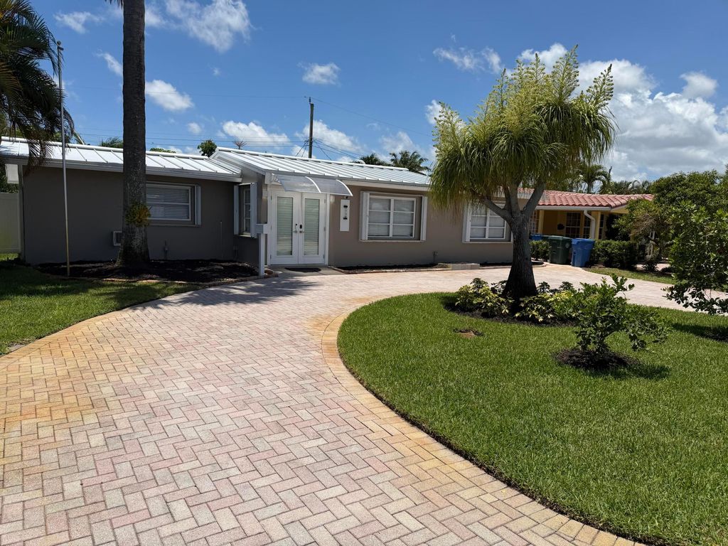 Photo of 1730 NW 39th Street, Oakland Park, FL 33309 (MLS # B26038316)