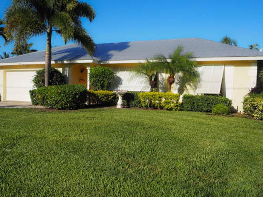 4 bedroom w/pool - newer metal roof, A/C and kitchen - new electrical panel - new carpet two bedrooms, rest of house all tile - freshly painted exterior.  Granite kitchen w all stainless appliances, pass through window to covered patio great for entertaining.  Crown molding, textured ceilings (no popcorn).  Split floor plan, cabana bathroom. 
Home is located on a canal front lot leading to Lake Floresta - you are able to canoe, boat, kayak down to the Lake and fish or paddleboard.  
All A-rated schools - Addison Mizner, Boca Middle and Boca High. Located adjacent to historic Old Floresta, close in to downtown Boca Raton, Mizner Park, the new downtown library the beach and more. Pull down attic stairs, laundry tub.