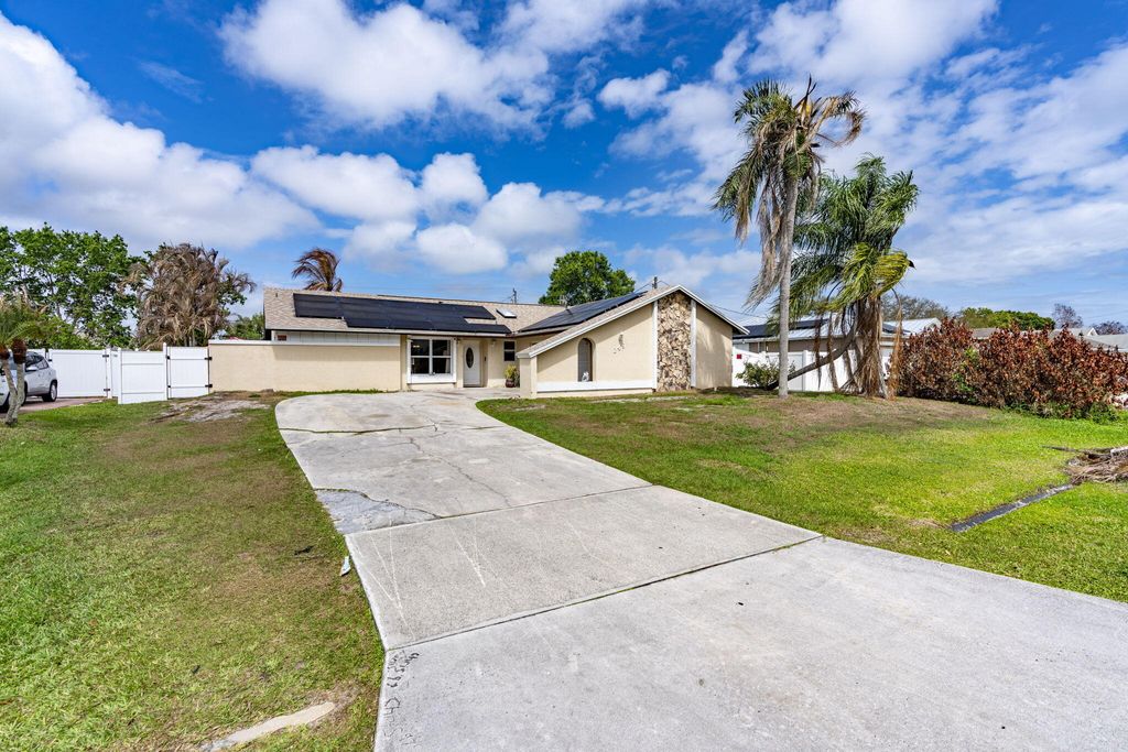 Photo of 249 NW Goldcoast Avenue, Port Saint Lucie, FL 34983 (MLS # B26002912)