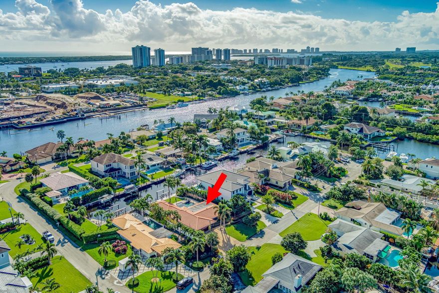 Stunning Waterfront Home with Direct Ocean Access - A Boater's Paradise in Prime Palm Beach Gardens Location!Experience luxury living in this beautiful3-bedroom, 3-bath waterfront home. Located only 150 yards from the Intracoastal Waterway, this home offers direct access to the ocean with no fixed bridges. Perfectly situated in the heart of the Palm Beach Gardens, this home is a haven for boating enthusiasts and is just steps away from the shopping, dining and marina district. It features a private dock equipped with a 13,000-pound boat lift and an expansive 77-foot deep-water seawall, recently rebuilt to accommodate your vessel.