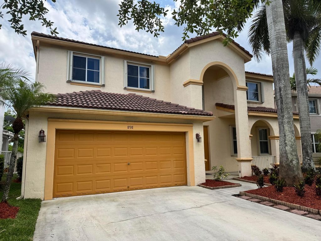 Photo of 898 Tulip Circle, Weston, FL 33327 (MLS # B26023454)