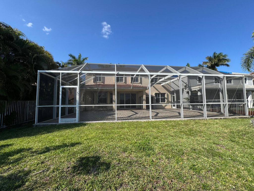 Photo of 898 Tulip Circle, Weston, FL 33327 (MLS # B26023454)